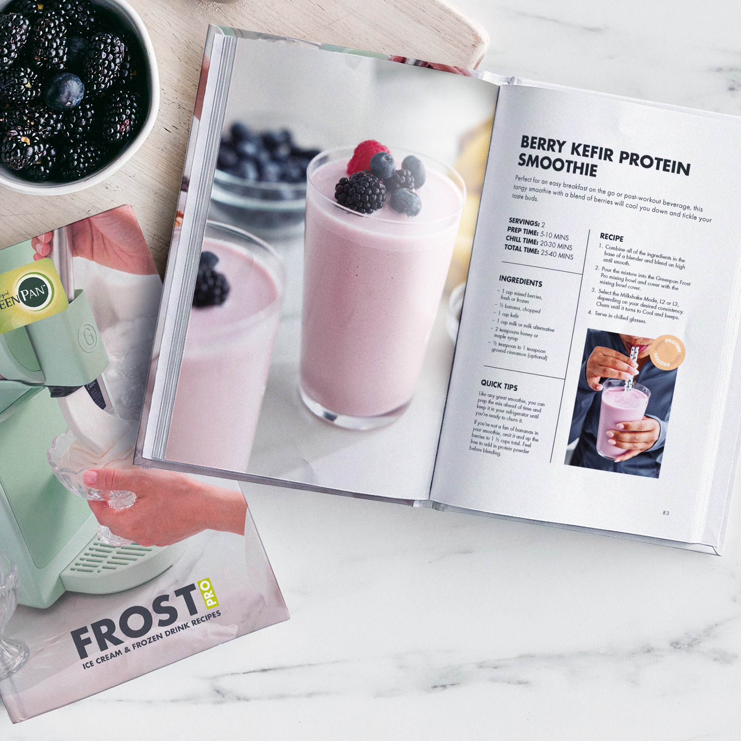 Open recipe book on table with a berry kefir smoothie, fresh berries, and gelato-making tips visible.