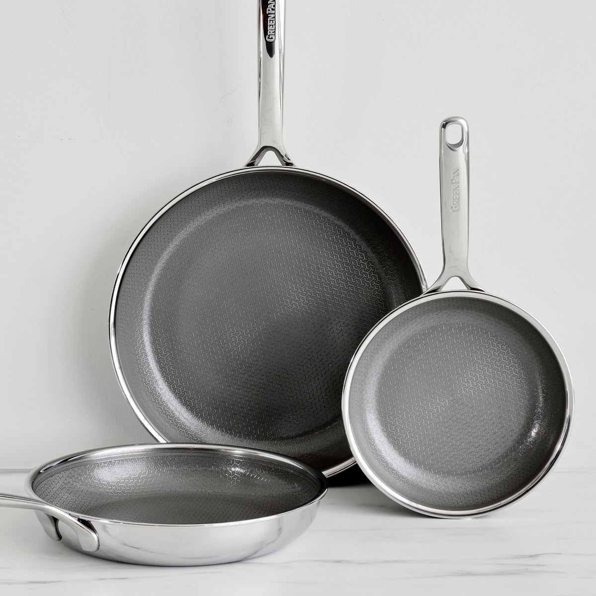Spectra Diamond Thermobond ceramic nonstick frypan set in 8, 10, and 12-inch sizes with silver handles and textured grey interiors.