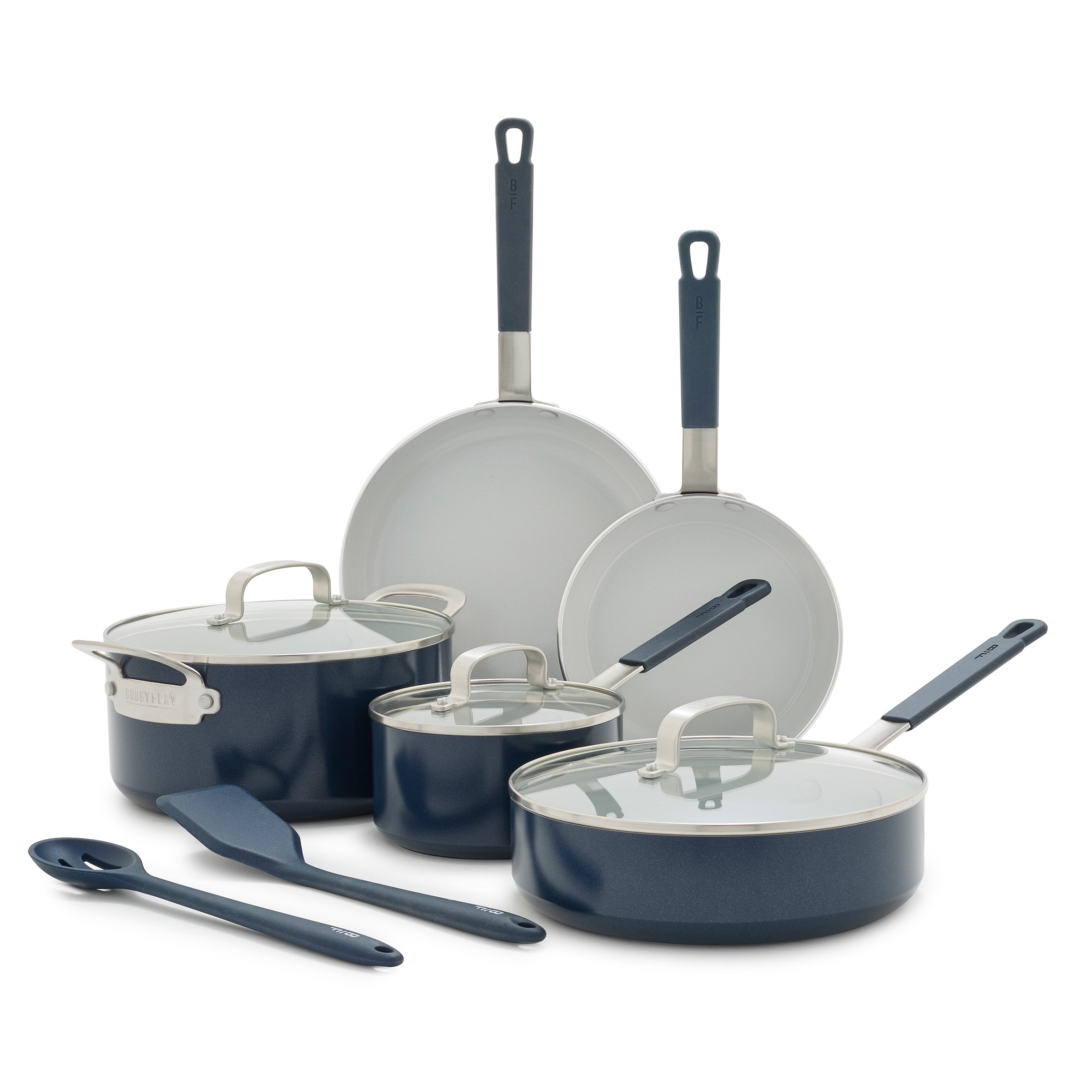 Oxford Blue 10-piece ceramic cookware set with pans, glass-lid pots, and utensils on a white background.
