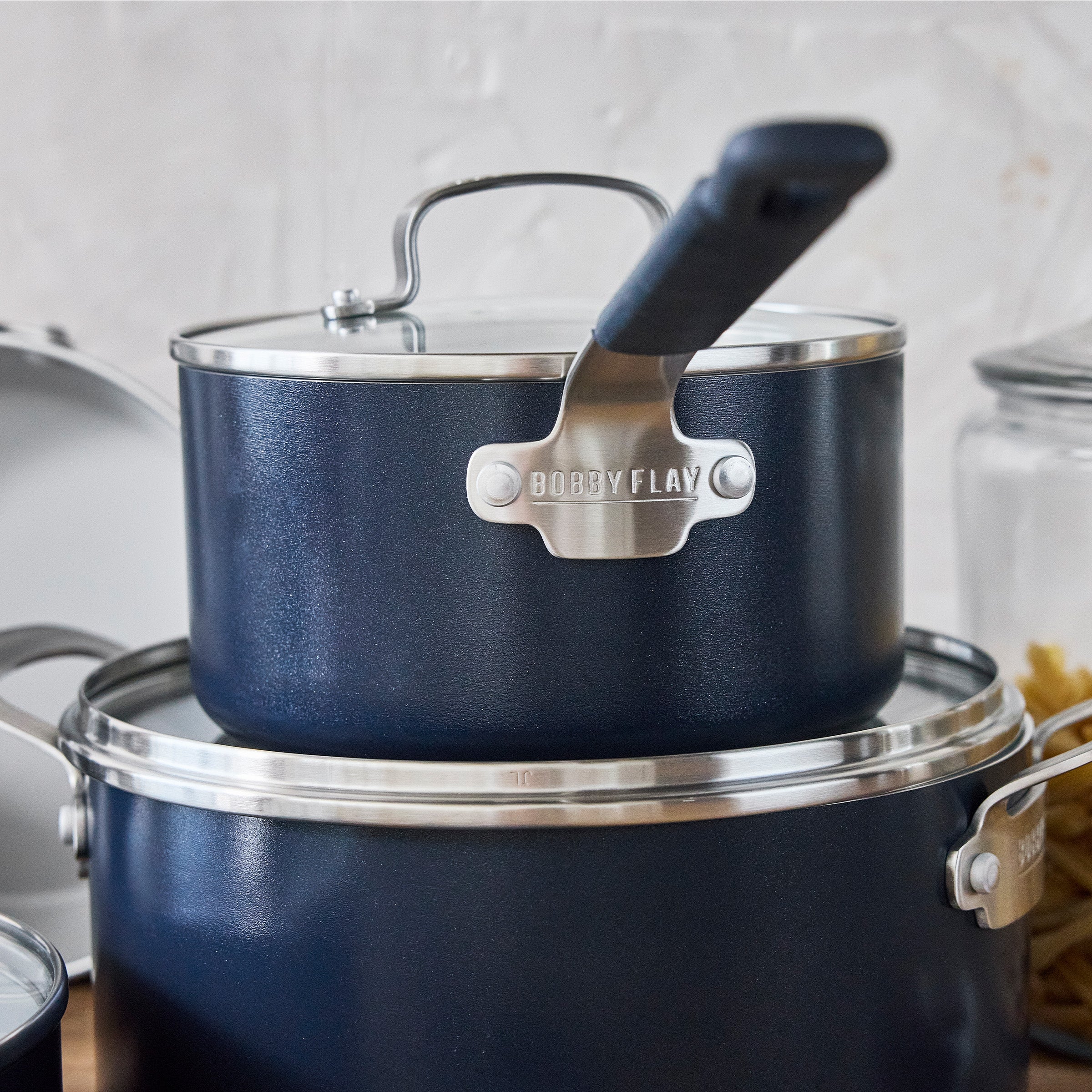 10-piece Oxford Blue cookware set with aluminum bodies, ceramic nonstick surfaces, and matching lids displayed together.