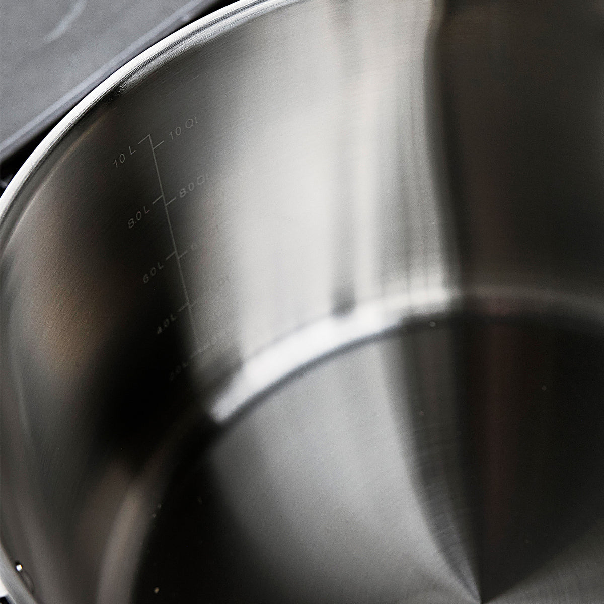 Bobby Flay by GreenPan 12-quart stainless steel stockpot interior with lid and graduated measurement markings.