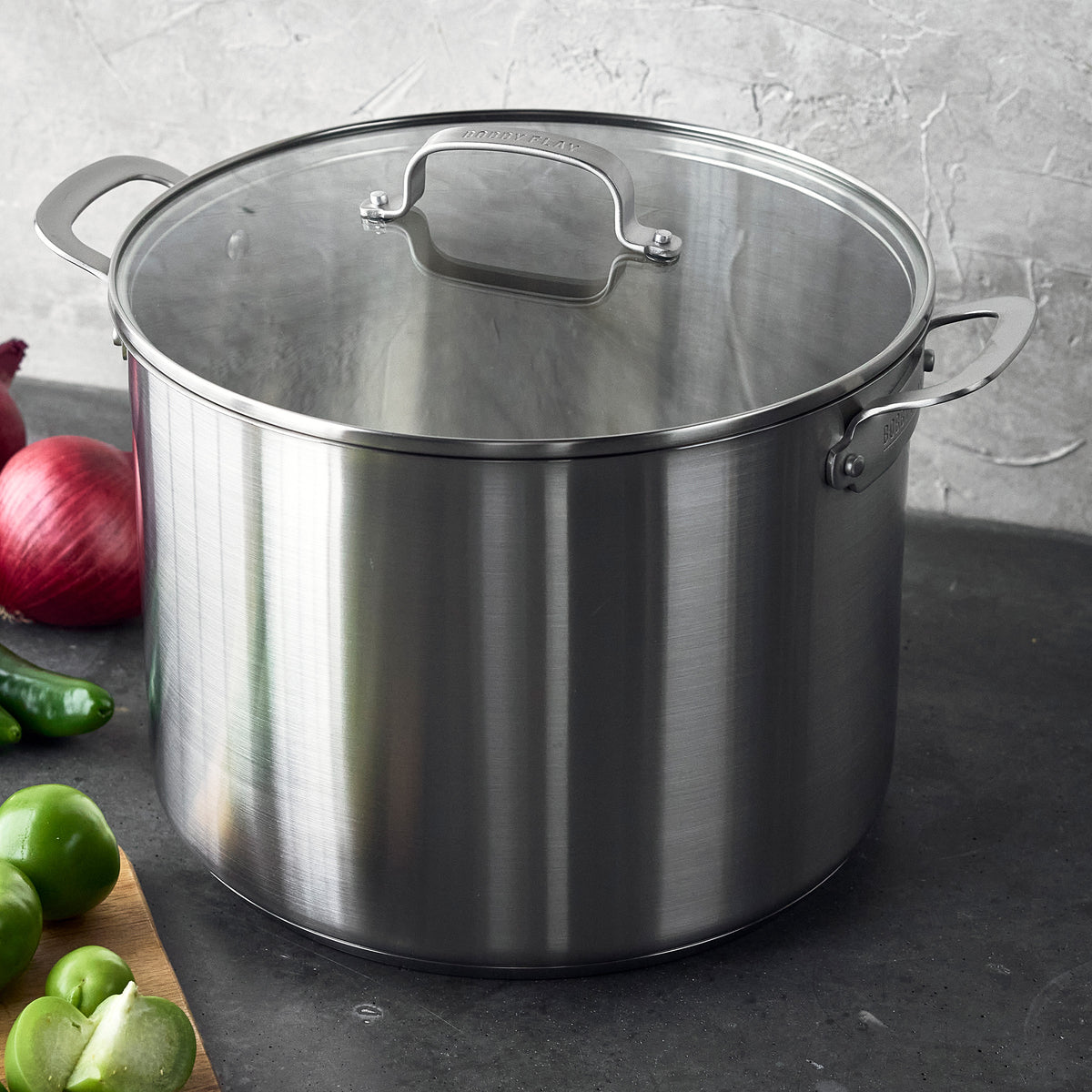 Bobby Flay by GreenPan 16-quart stainless steel stockpot with glass lid.