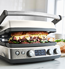 a white electric griddle on a countertop 